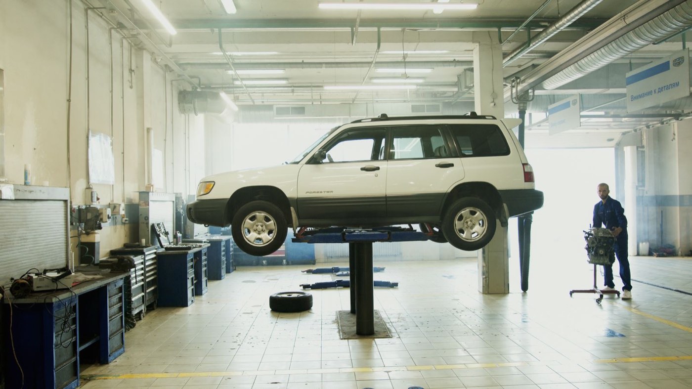A pickup on a lift in the bay at Tallow Creek Auto